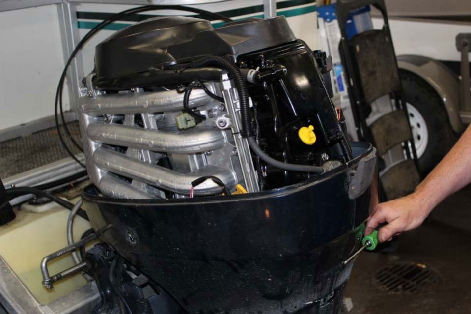 outboard engine being serviced outboard engine being serviced